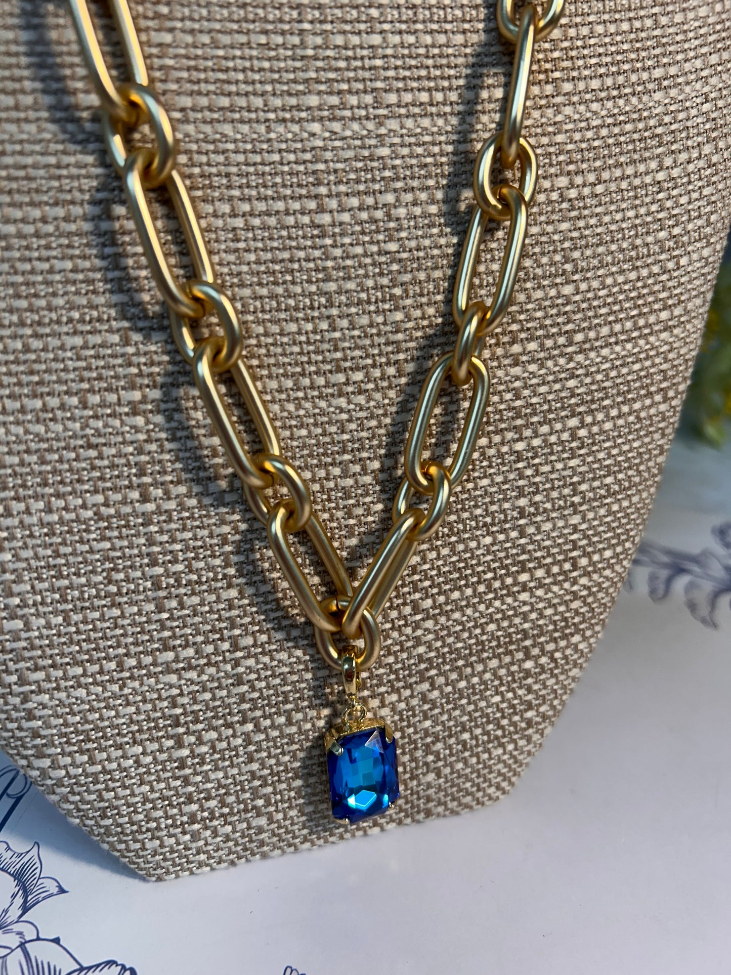 Matte Gold Necklace with Blue Crystal Pendant